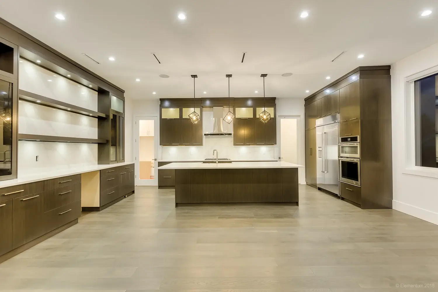 Large Vancouver kitchen with dark wood cabinetry, center island, and stainless steel appliances
