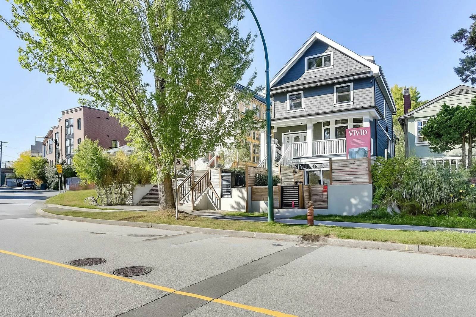 Vancouver blue and gray heritage style home exterior with covered front porch