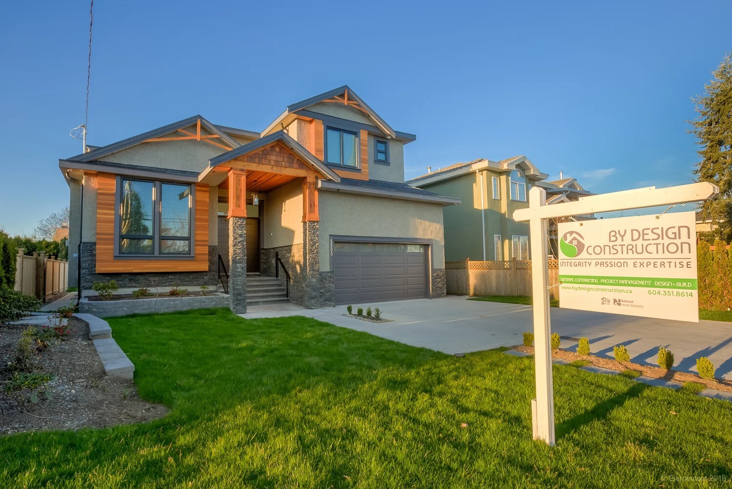 Vancouver craftsman style home exterior with cedar shake accents, stone veneer, and covered entry
