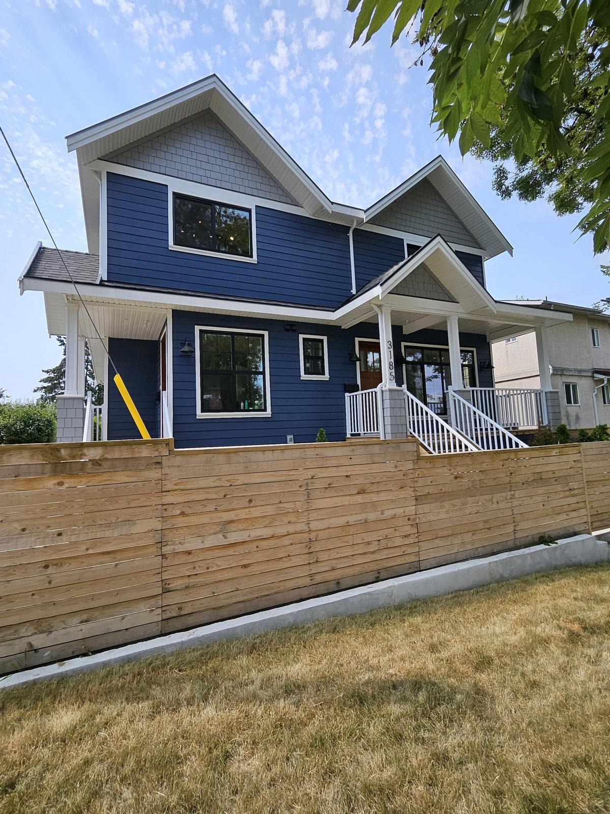 Vancouver two story navy blue and gray craftsman home exterior with covered porches